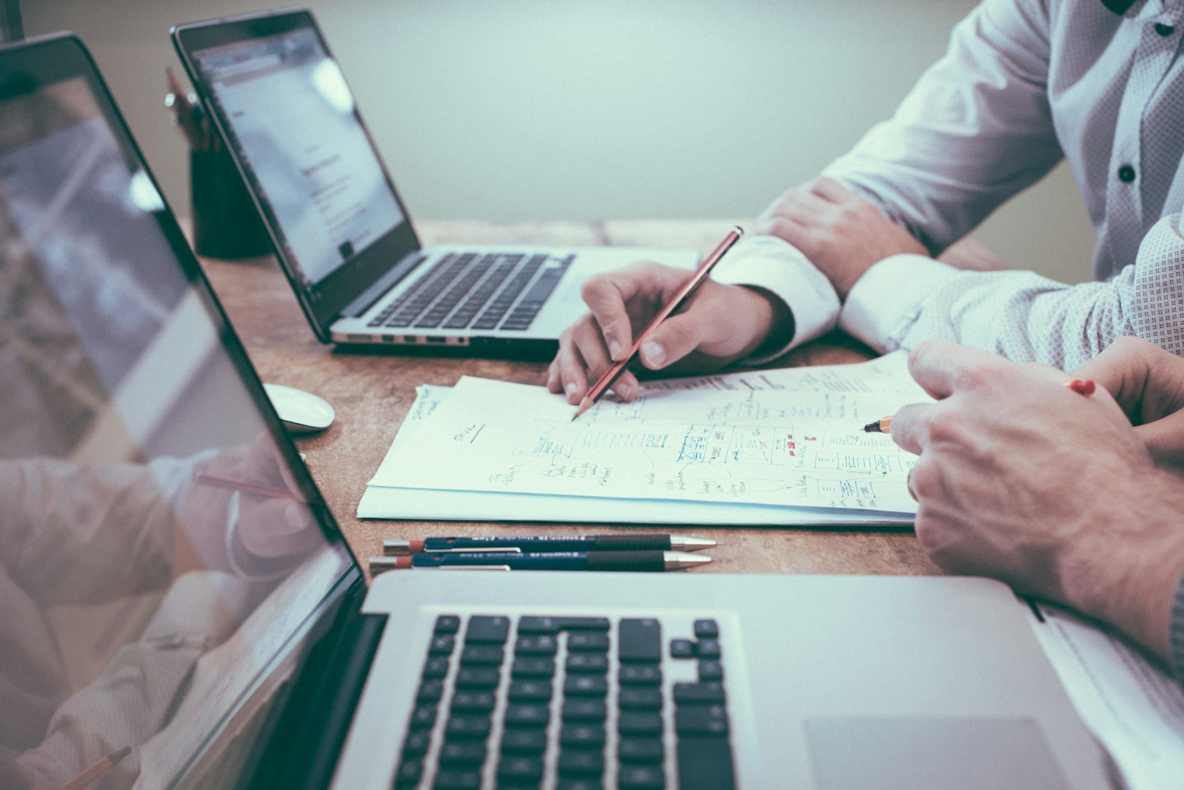 Professional reviewing documents at a desk